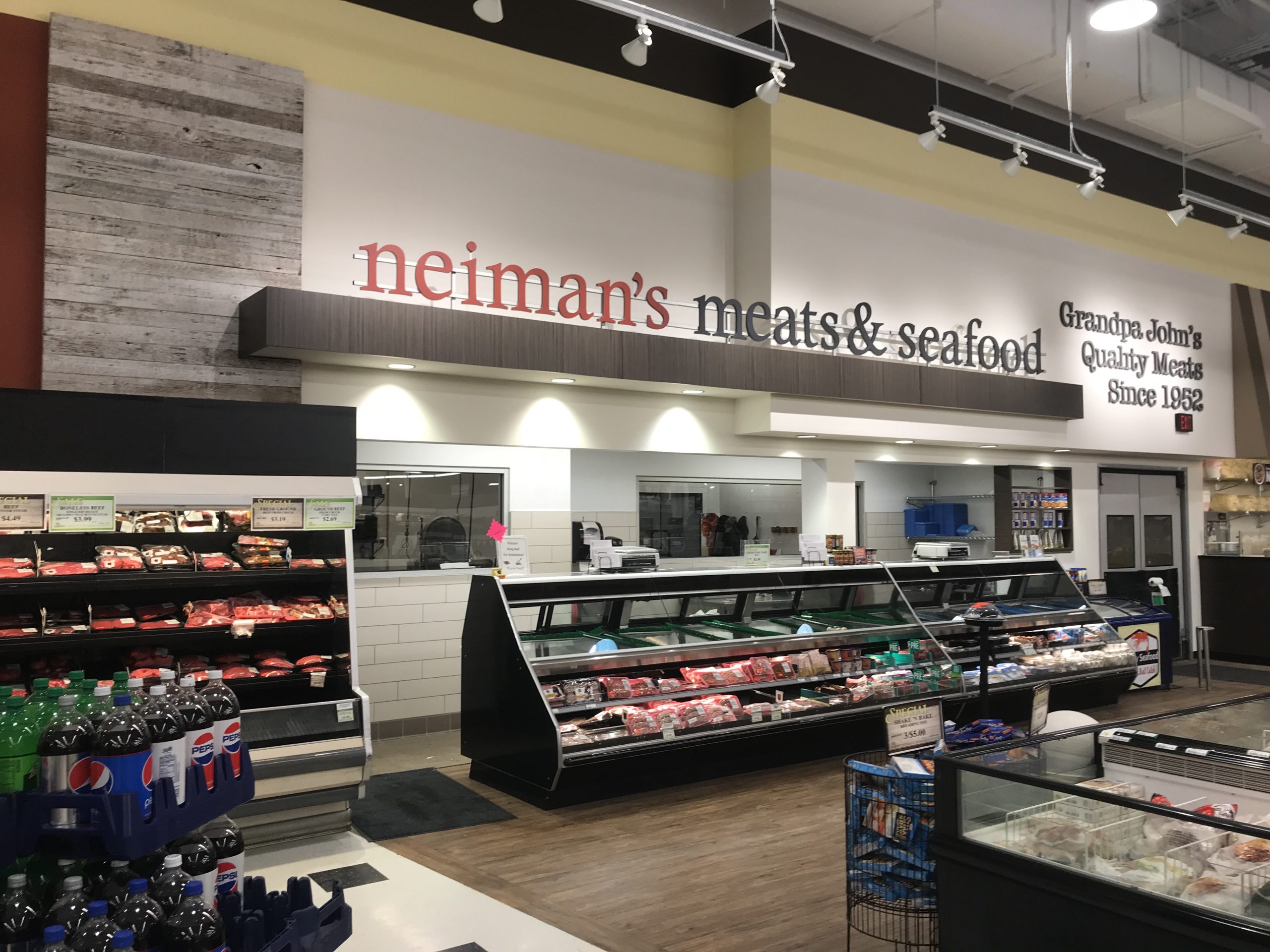 StoreMasters highlights the prepared foods, hot meals, and deli with signage that encourages families eating together