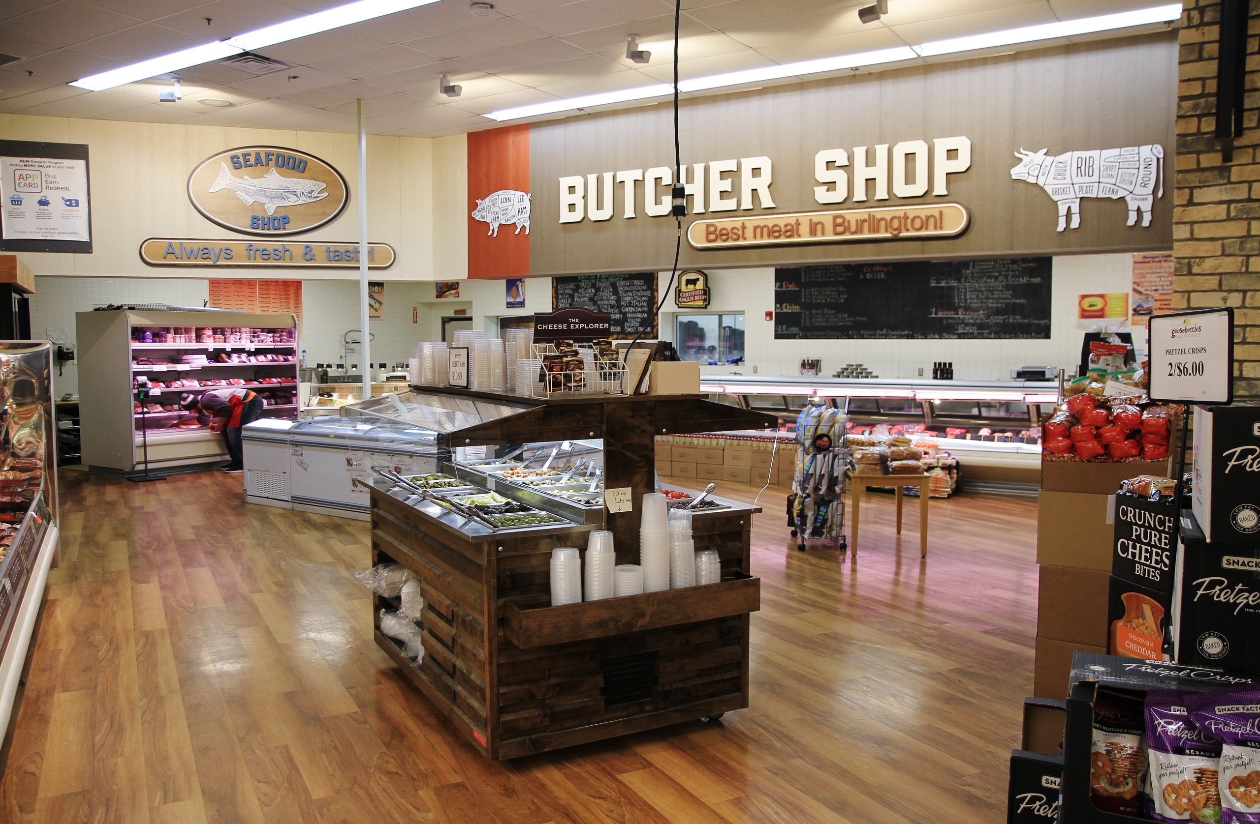 StoreMasters custom lighting and flooring package updated this home town store into a food lovers destination